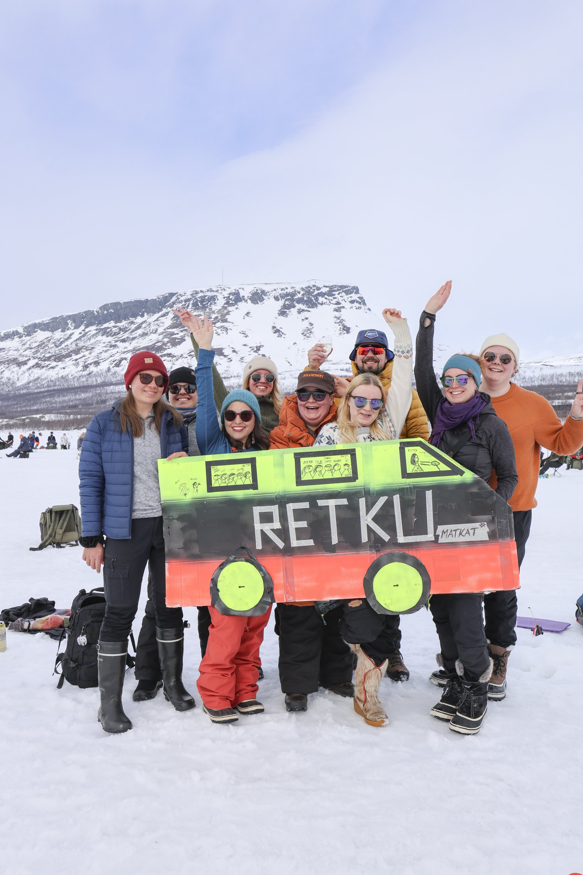 Joyful Retkeilykeskus staff enjoying the Vain kaksi kalaa ice fishing festival on the spring ice